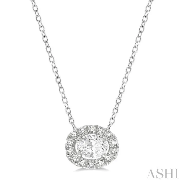 1/4 ctw Oval and Round Cut Diamond Halo Fashion Pendant With Chain in 14K White Gold